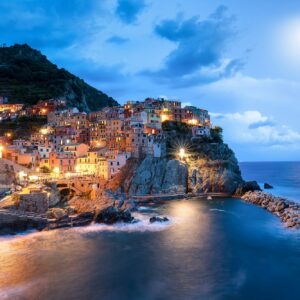 Blue moon and Manarola village at night, Cinque Terre, Italy, Europe